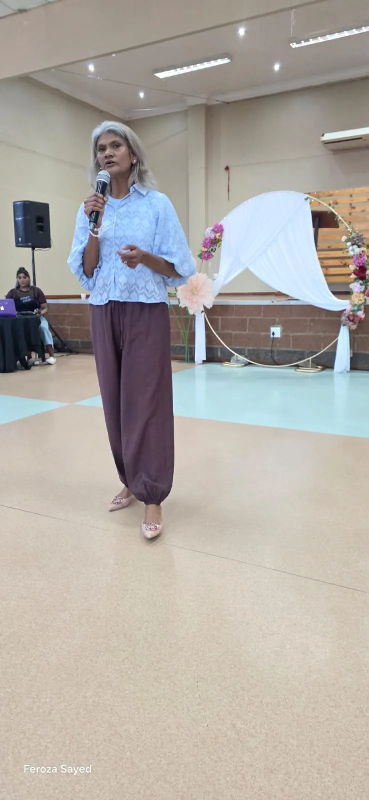A speaker presenting to an audience