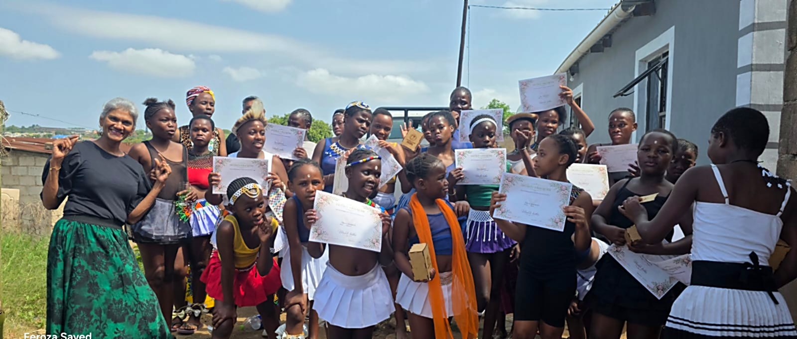 FSI community members celebrating certificates together outdoors